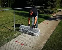 Chain Link Fence-Unroll the mesh and install a tension bar
