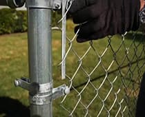 How To Install Chain Link Fence-Attach the tension bar to the posts