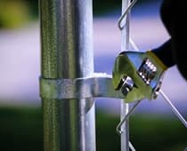 How To Install Chain Link Fence-Attach the tension bar