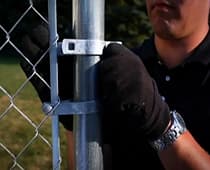 How To Install Chain Link Fence-Tie the fence to the rails
