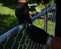 Install Chain Link Fence-Run wire through the bottom loops of mesh